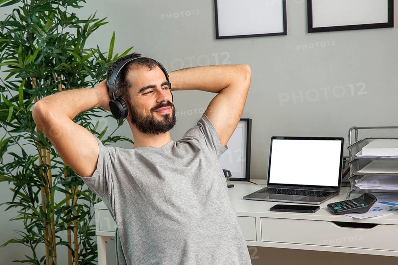 Man using headphones while working from home