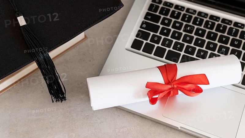 Certificate with ribbon bow laptop