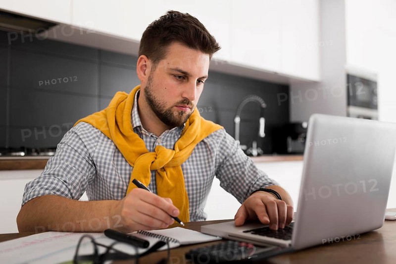 Portrait adult male working from home