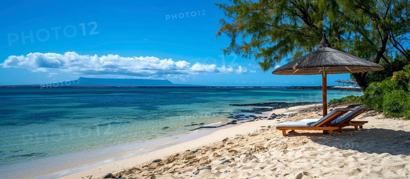 Tropical beach scene with lounge chairs under an umbrella, clear blue sky, and calm ocean waters, AI generated