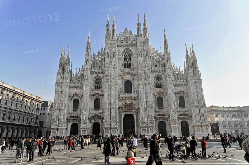 Milan Cathedral, Milan Duomo, construction started in 1386, completed in 1858, Milan, Milano, Lombardy, Italy, Europe, People enjoy the square in front of Milan Cathedral. The building shows gothic architecture, Europe