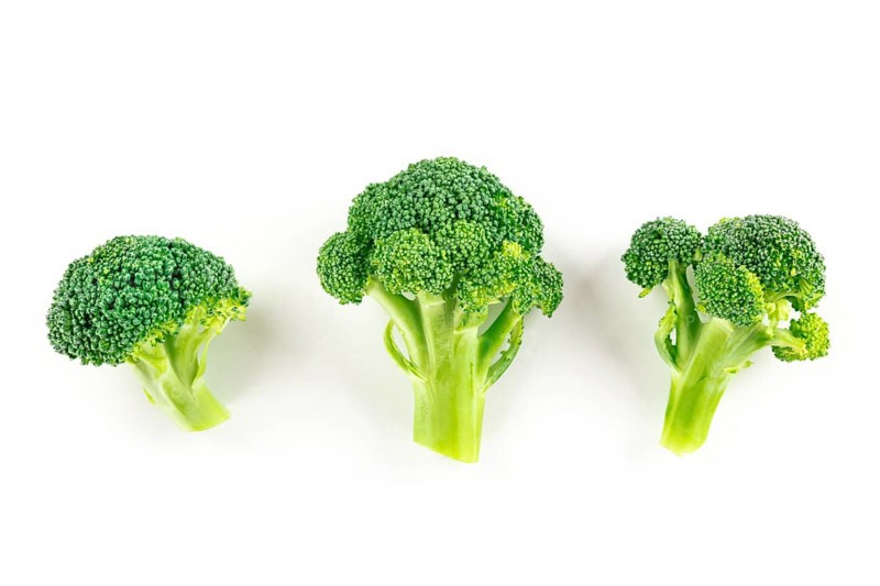 Broccoli florets, shot from the top on a white background