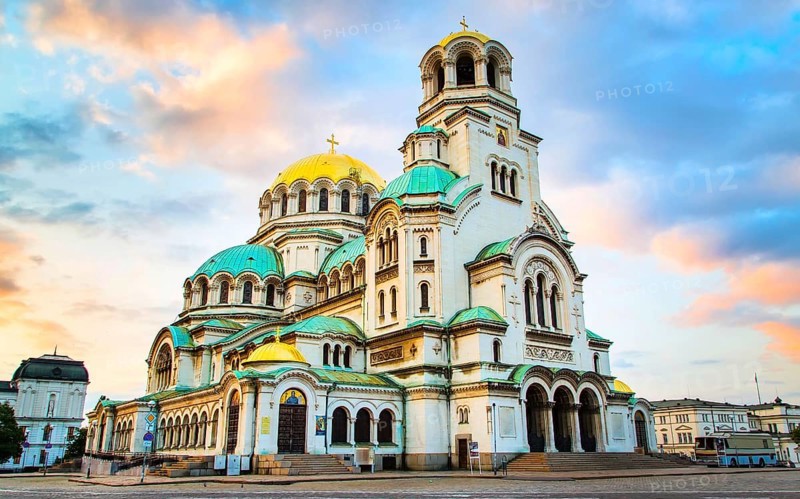 St. Alexander Nevsky Cathedral in the center of Sofia, capital of Bulgaria against the blue morning sky with colorful clouds