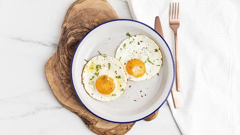 Top view breakfast fried eggs plate with cutlery. Resolution and high quality beautiful photo