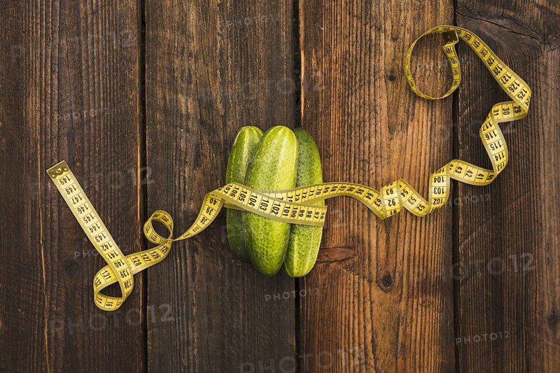 High angle view fresh cucumbers measuring tape wooden background. Resolution and high quality beautiful photo