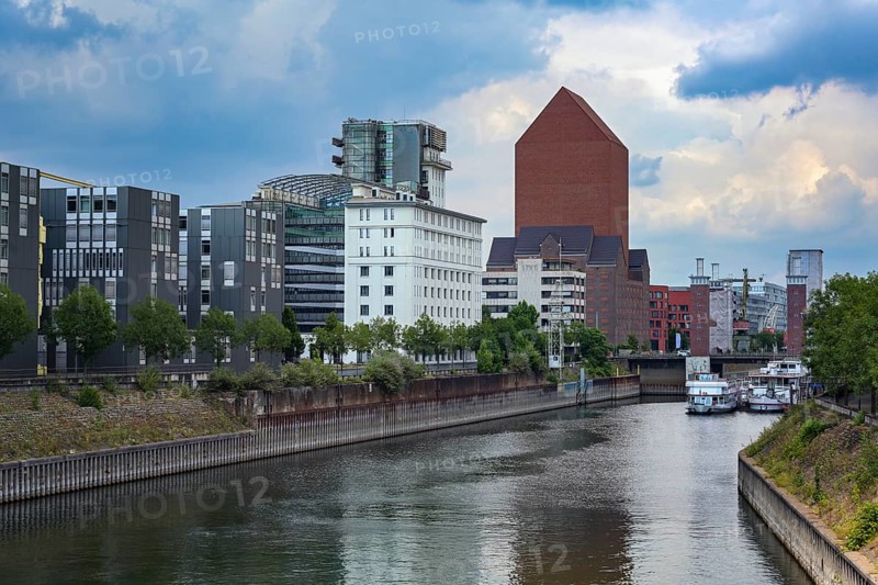 Inner harbor of Duisburg, Germany with the State archive of North Rhine-Westphalia, the monumental tower building of red brick without windows was a former granary, copy space