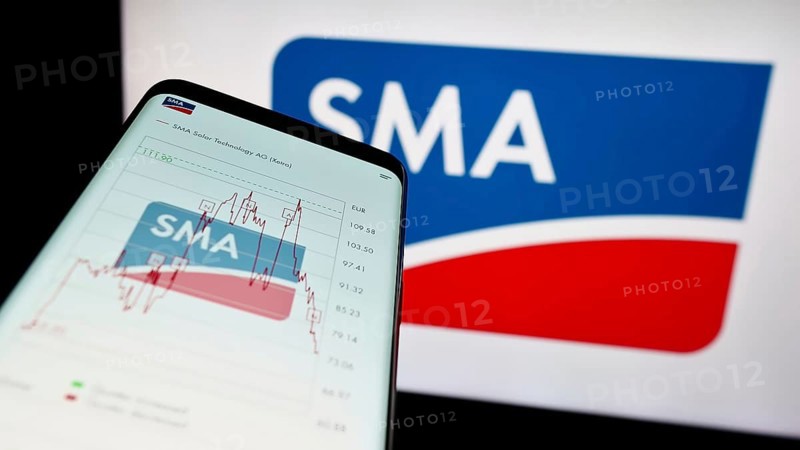 Stuttgart, Germany, 08-21-2023: Mobile phone with website of German company SMA Solar Technology AG on screen in front of business logo. Focus on top-left of phone display, Europe