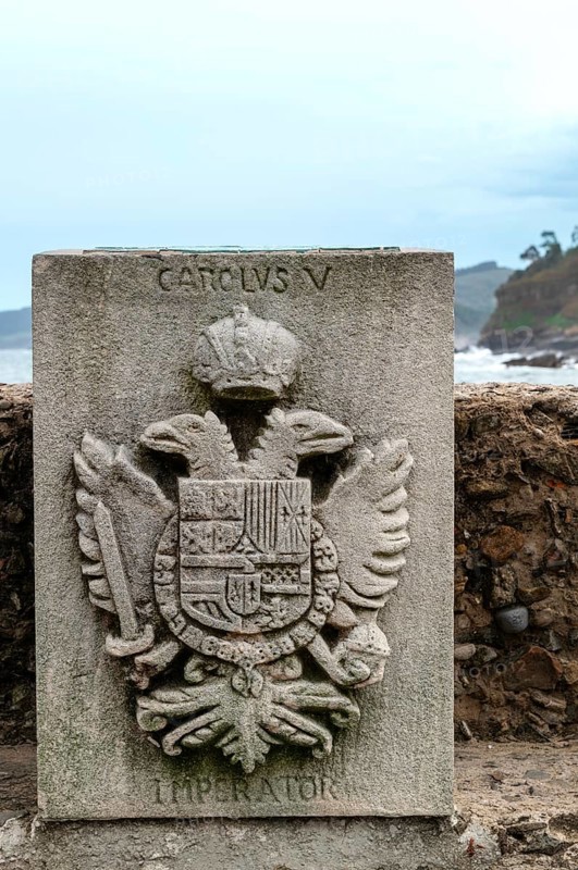 Memorial stone with the coat of arms of Emperor Charles V, commemorating his landing in Tazones on 17 September 1517, fishing village of Tazones, municipality of Villaviciosa, Asturias, Principado de Asturias, Spain, Europe