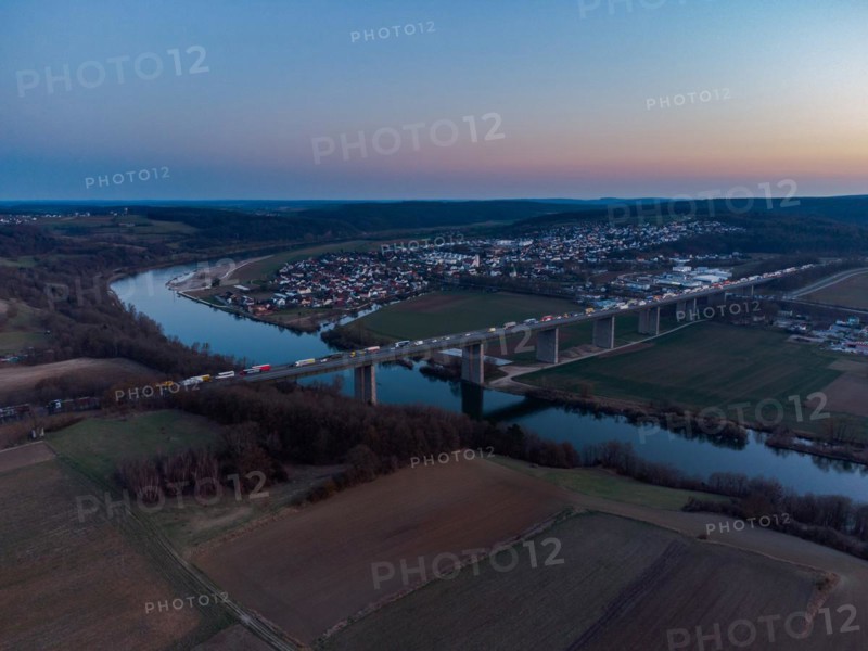 Aerial drone view of heavy traffic jam on German Autobahn bridge over Danube river near Sinzing, Regensburg, Bavaria