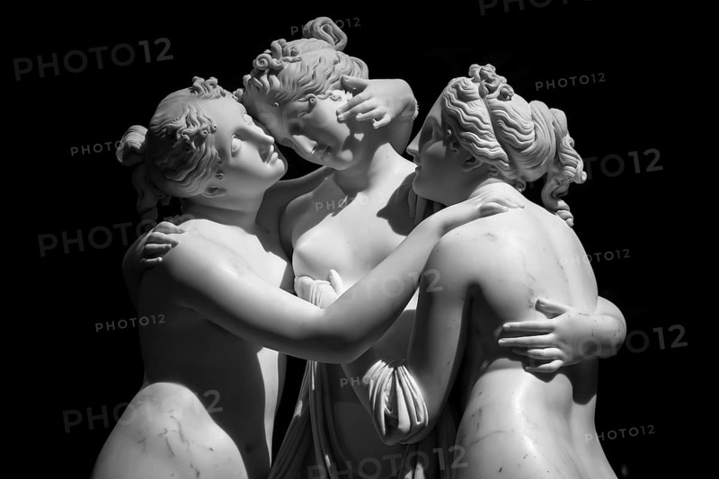 Milan, Italy - June 2020: Antonio Canova?s statue The Three Graces (Le tre Grazie). Neoclassical sculpture, in marble, of the mythological three charites (made in Rome) (1814-1817)