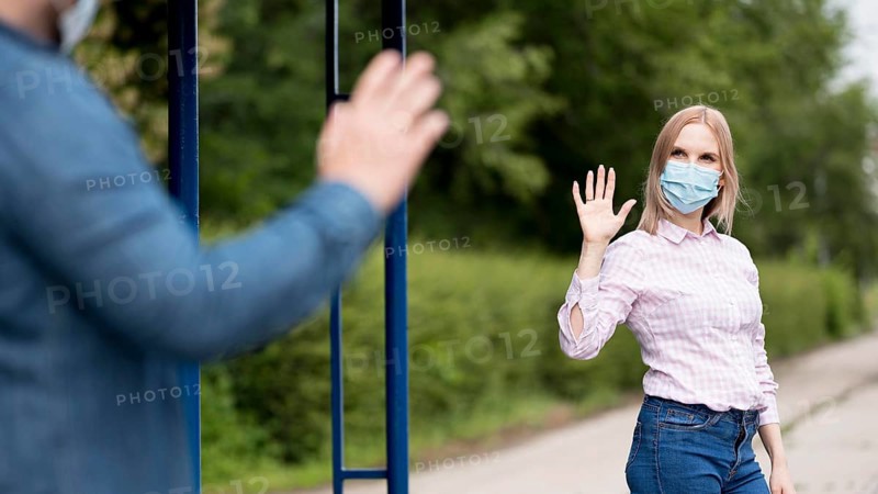 Man woman keeping social distance