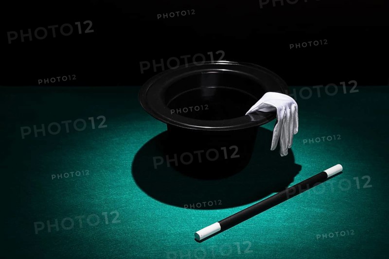 Spot light top hat with white gloves wand. Beautiful photo