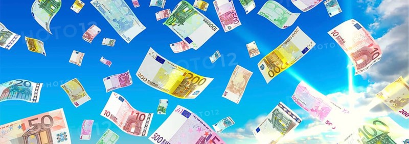 Money rain from the clouds in the sunshine