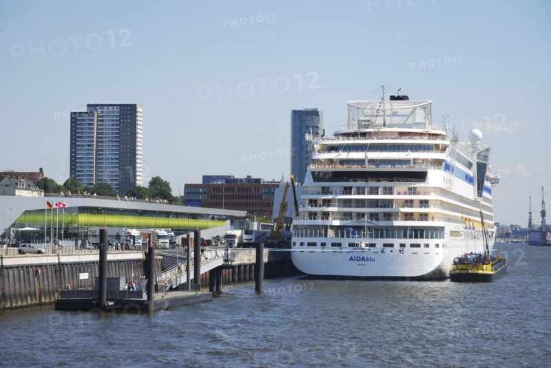 HAMBURG, GERMANY, AUGUST 20: Cruise liner Aidablu at the Hamburg harbor (St. Pauli Landungsbrücken -St. Pauli Landing Bridges) on August 20, 2011. Foto taken from rund trip through the harbor by boat. AIDAblu belongs to the AIDA crouses compnay. It is one of their biggest ships