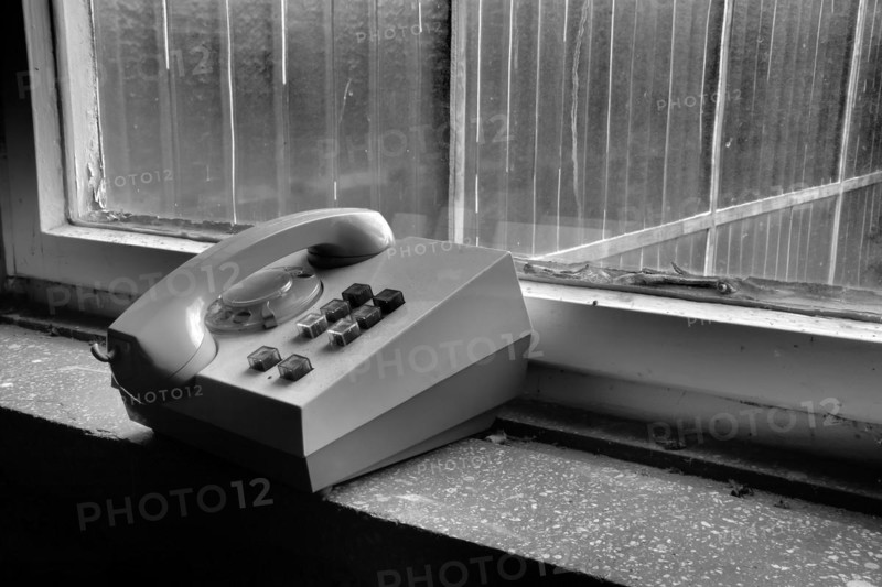 Old telephone in a disused factory