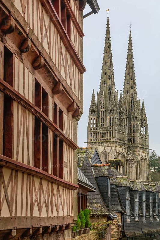 Towers of Saint-Corentin Cathedral, half-timbered house, slate-roofed house in Rue du Lycee, Quimper, Finistere Penn-ar-Bed department, Brittany Breizh region, France, Europe