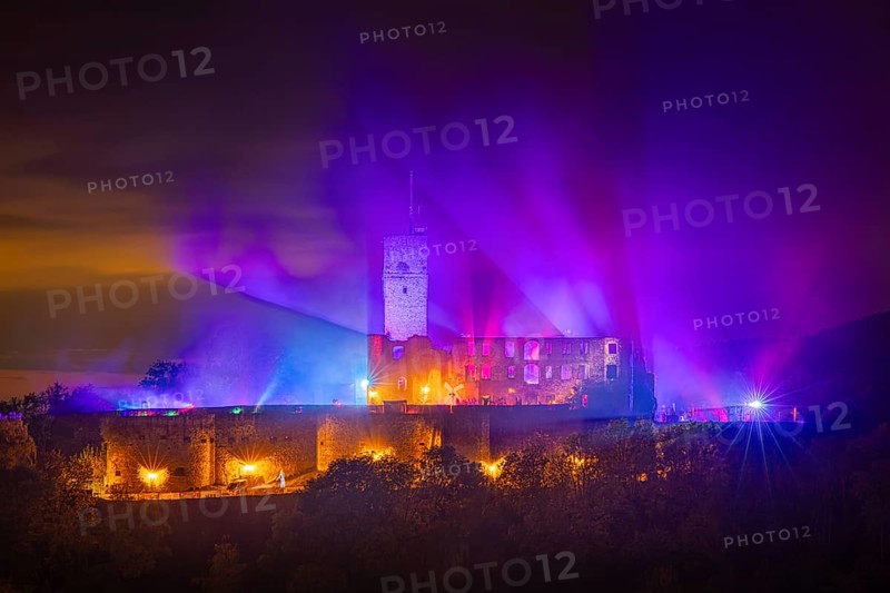 The castle in the town of Königstein im Taunus is brightly illuminated in the evening. From 18 October to 3 November 2024, the castle ruins will host the Frankenstein Halloween Festival under the motto A new Chapter of Fear, Taunus, Königstein, Hesse, Germany, Europe