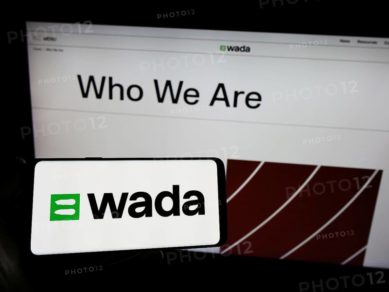 Stuttgart, Germany, 07-09-2023: Person holding smartphone with logo of organization World Anti-Doping Agency (WADA) on screen in front of website. Focus on phone display, Europe