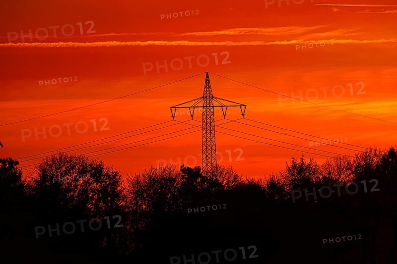 High-voltage pylon, electricity pylon with high-voltage lines at sunset, Bad Wünnenberg, North Rhine-Westphalia, Germany, Europe