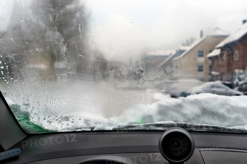 View through a steamed-up windscreen in winter