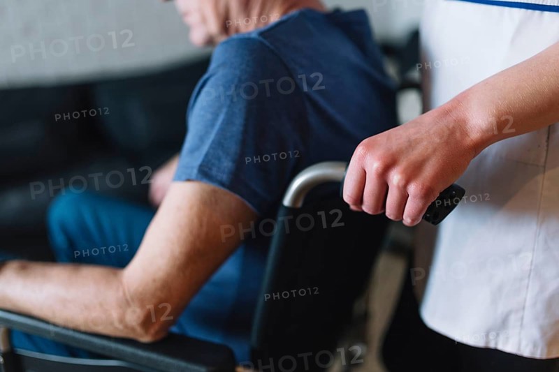 Man wheelchair old age home. High resolution photo