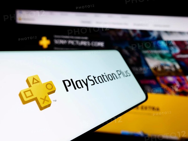 Stuttgart, Germany, 02-14-2024: Cellphone with logo of subscription service PlayStation Plus (PS Plus) in front of business website. Focus on left of phone display, Europe