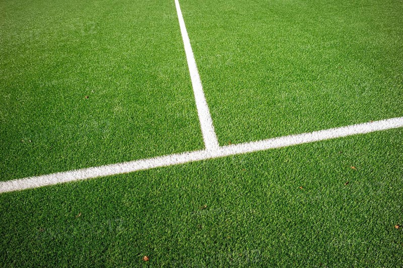 Detail of a football pitch with clear marking lines on green artificial turf, Bottrop, North Rhine-Westphalia, Germany, Europe