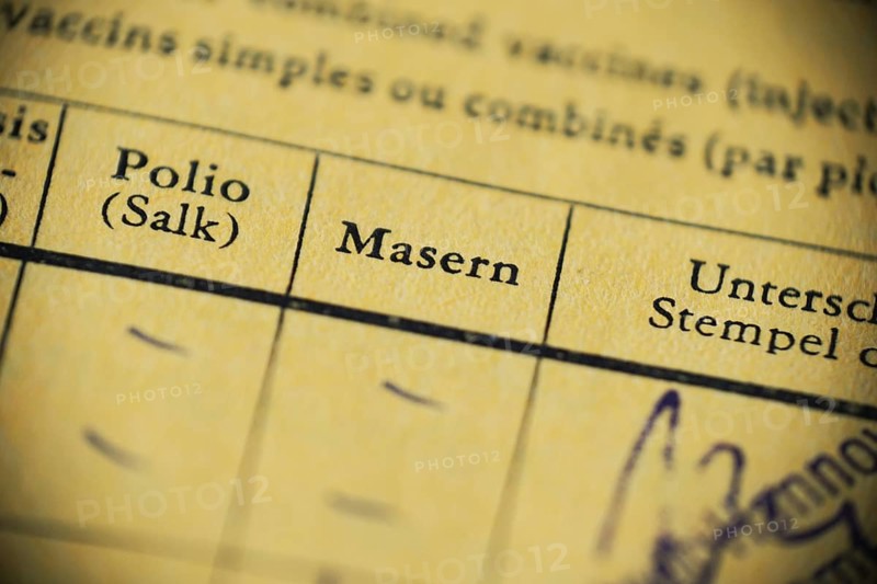 Masern is German for measels - international certificate of vaccination - anti-vaccination concept