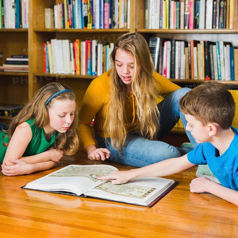 Kids looking pictures library book