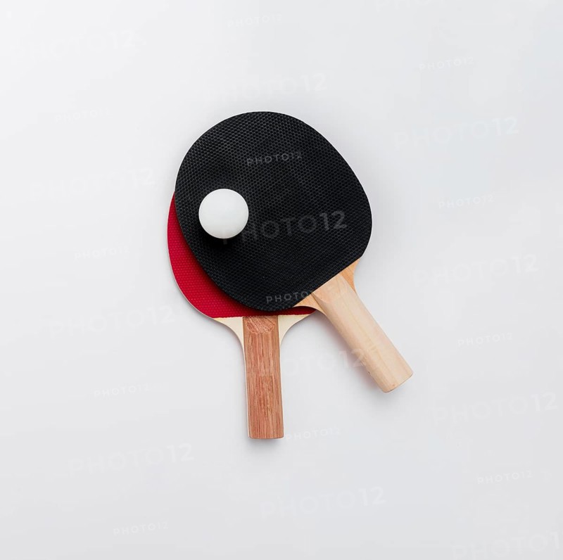 Top view ping pong paddles with ball