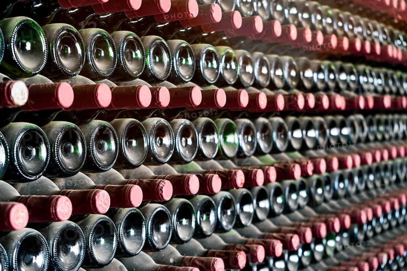 Many bottles in a row stacked on a winery shelf, Lanzarote, Spain, Europe