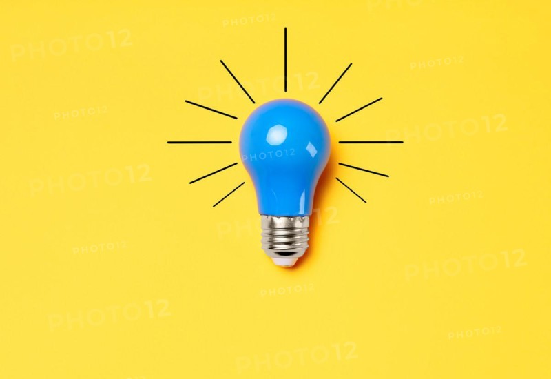 Concept creative idea with lightbulb on yellow background. Solution symbol, business creativity, inspiration and motivation for success