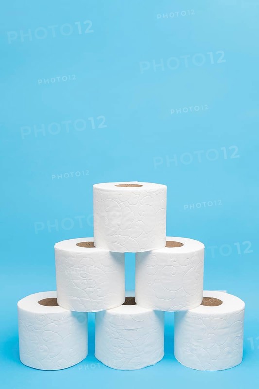 Front view toilet paper rolls stacked pyramid shape