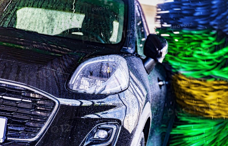 A vehicle in an automatic car wash