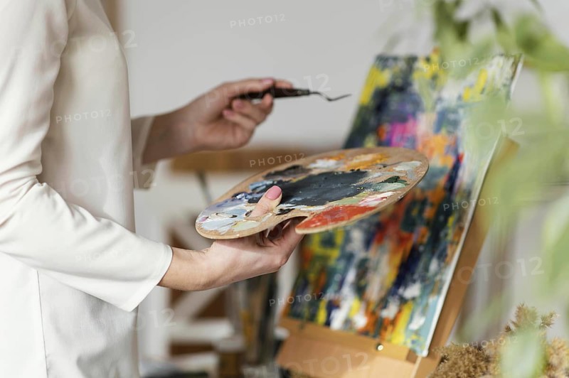 Young blonde woman painting with acrylics. Resolution and high quality beautiful photo