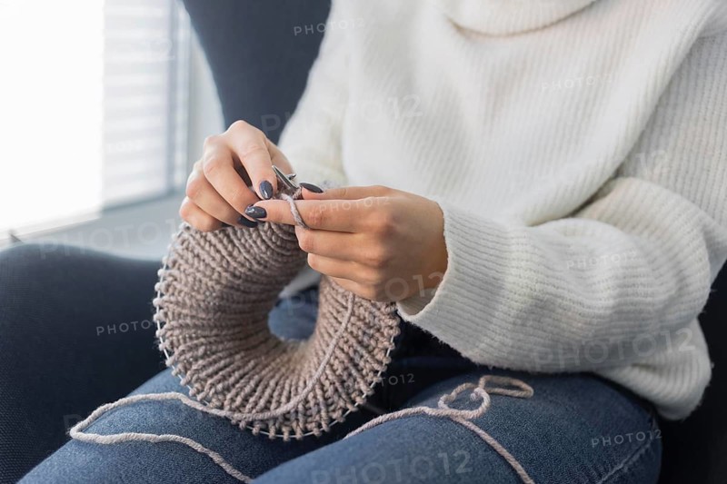 Woman home knitting close up 11