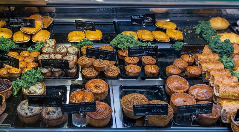Conwy, United Kingdom, 27 August, 2022: close-up view of a butcher shop showcase with a variety of steak and pork pies, Europe