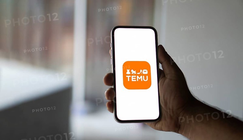 Temu logo online marketplace ecommerce on a smartphone and computer in Stuttgart, Germany.