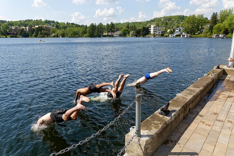 Summer, boys jumping into a lake, Saint Agathe, Province of Quebec, Canada, North America