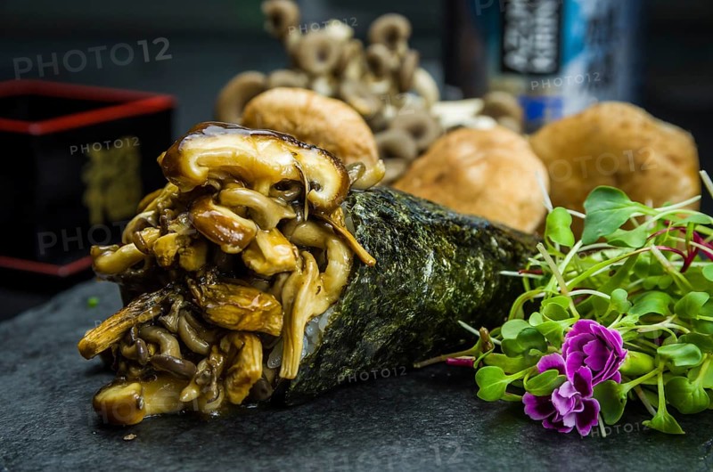 Sushi. Traditional Japanese cuisine, Temaki premium mushrooms, shitake, shimeji, decorated in an elegant setting
