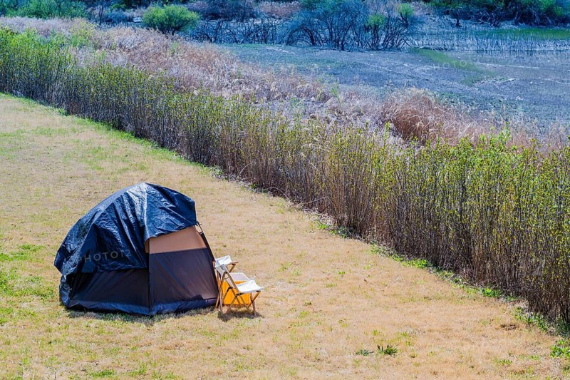 One man tent pitched in field in countryside in South Korea