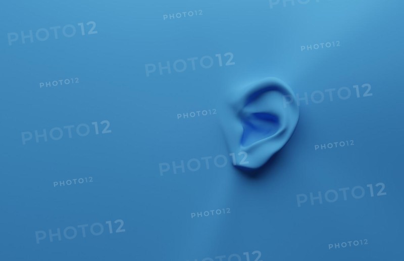 3d rendering of an ear on a blue background with space for your text or image, health care or alertness concept