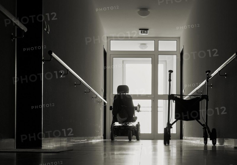 Lonely corridor with rollator in a retirement home