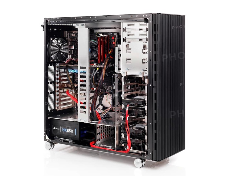 PC computer open ATX case with motherboard and other hardware installed isolated on white background