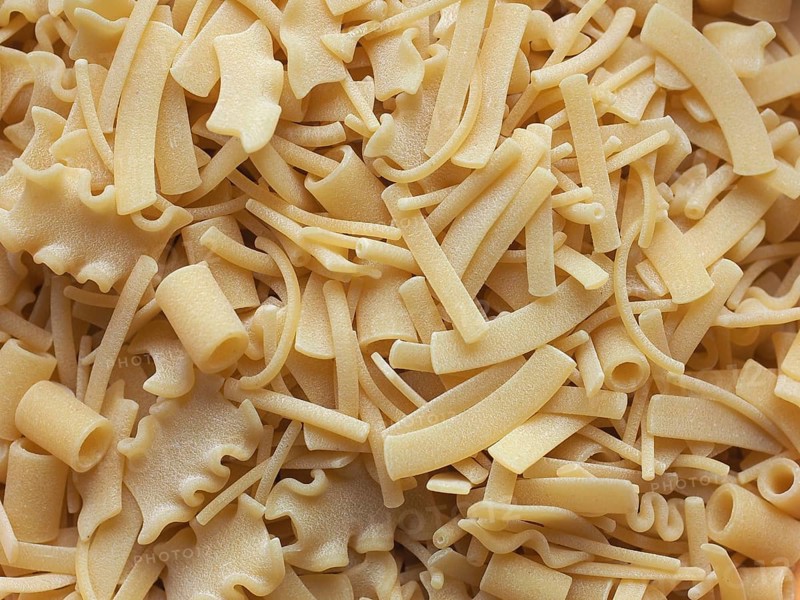 Mixed pasta of various shapes background