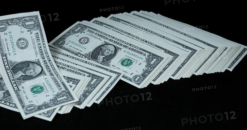 1 US Dollar Banknotes falling against Black background