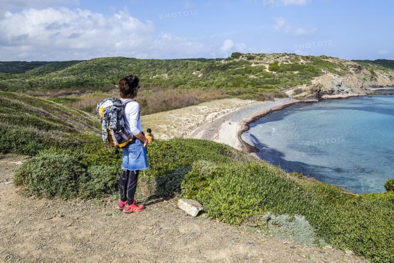 Hiker on Tortuga beach, s'Albufera des Grau Natural Park, Menorca, Balearic Islands, Spain, Europe