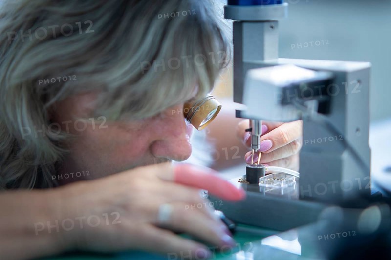 Nomos Glashütte is a German watch manufacturer from Glashütte in Saxony, which produces and sells mechanical wristwatches with hand-wound and, since 2005, automatic movements. Pressing of movement components, NOMOS Uhren, Schlottwitz, Saxony, Germany, Europe