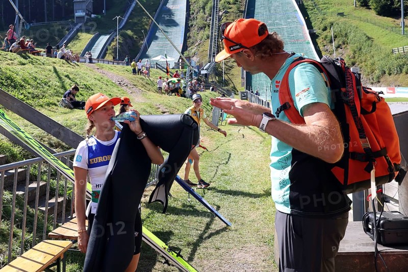 Katharina Althaus (SC Oberstdorf) in conversation with woman's national coach Heinz Kuttin at the COC Cup summer ski jumping Hinterzarten 2024