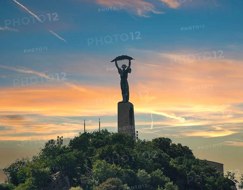 Liberty statue in Budapest on Gellert Hill at sunset